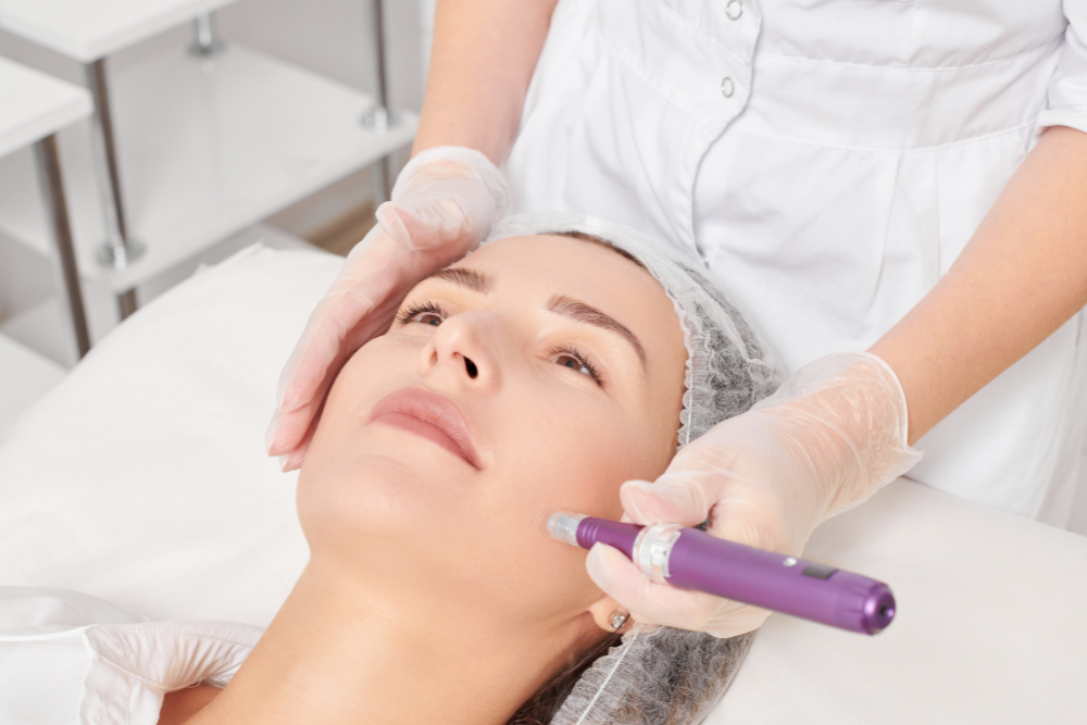 A person having a friendly consultation with a dermatologist in a clinic setting.