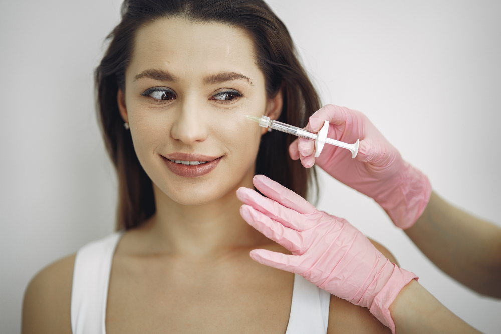 A photo of a person receiving a PRP Facelift treatment on their face.