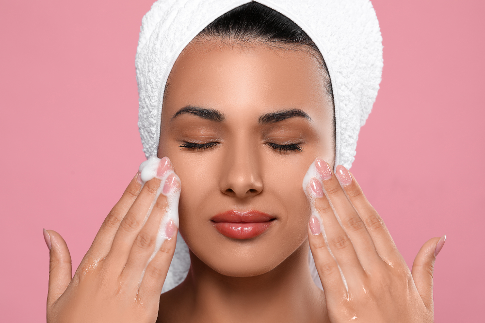 A split-screen image showcasing a person gently cleansing their face on one side and applying moisturizer on the other side.